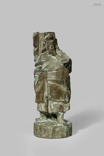 A BRONZE SCULPTURE OF GUAN YU BY JU MING (1938-) 1985 The deified warrior stands in a fierce pose