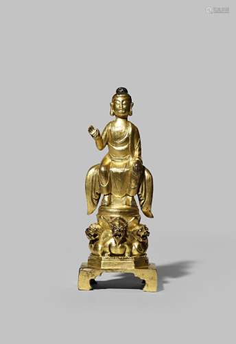 A CHINESE TANG-STYLE GILT BRONZE FIGURE OF BUDDHA QING DYNASTY Seated, wearing long robes, his