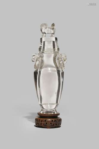 A LARGE CHINESE ROCK CRYSTAL VASE AND COVER QING DYNASTY With a tapering body and a waisted shoulder