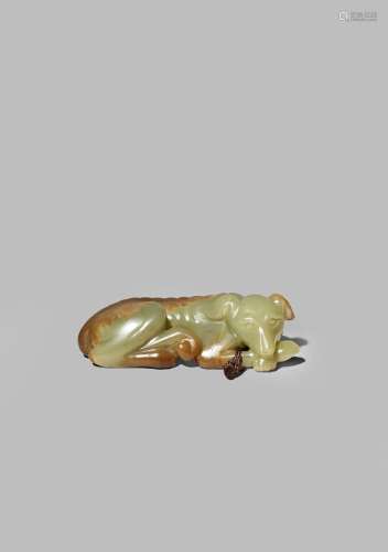 A CHINESE YELLOW-GREEN JADE CARVING OF A HOUND QING DYNASTY Recumbent with his body curved and his