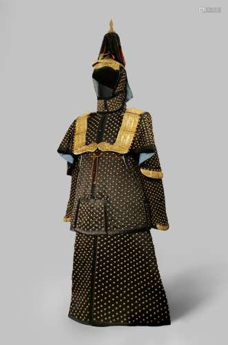 *A CHINESE BLUE-BLACK GROUND SILK SUIT OF CEREMONIAL ARMOUR AND HELMET OF A GENERAL QING DYNASTY