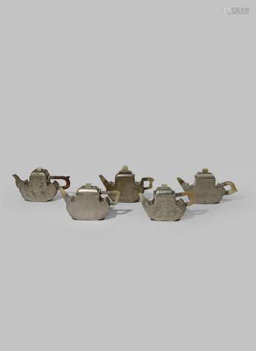 FIVE CHINESE INSCRIBED PEWTER-ENCASED YIXING TEAPOTS AND COVERS QING DYNASTY Each with a ruyi-head-