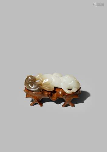 A CHINESE WHITE AND BROWN JADE CARVING OF TWO BADGERS 18TH CENTURY The cub carved from the brown