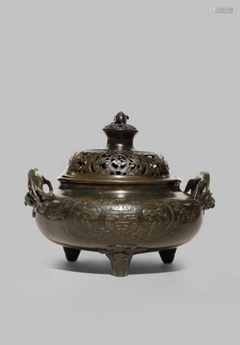 A RARE CHINESE BRONZE INCENSE BURNER AND COVER EARLY QING DYNASTY With a compressed circular body,