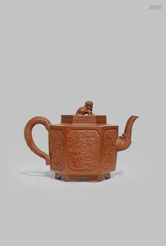A CHINESE YIXING HEXAGONAL TEAPOT AND COVER 18TH CENTURY The body with two panels moulded with a