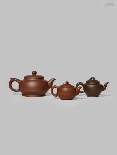 THREE CHINESE YIXING TEAPOTS AND COVERS 19TH AND 20TH CENTURY One with a ribbed body, another with
