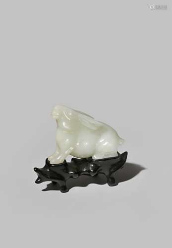 A CHINESE WHITE JADE MODEL OF A HARE QING DYNASTY Crouching with its head raised and its ears pushed