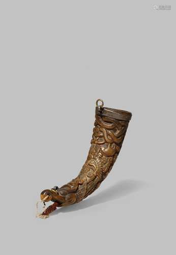 A TIBETAN HORN POWDER FLASK 18TH/19TH CENTURY Carved in the form of a mythical creature, decorated
