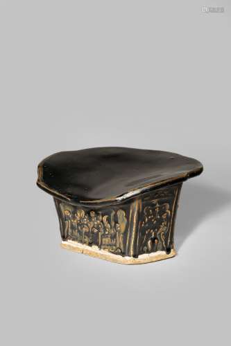 A CHINESE HENAN BLACK GLAZED MOULDED PILLOW SONG DYNASTY 960-1279 The top shaped as a ruyi-head, the