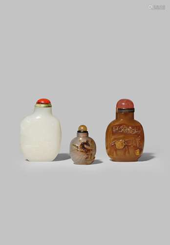 THREE CHINESE HARDSTONE SNUFF BOTTLES QING DYNASTY One of white jade carved in shallow relief with a