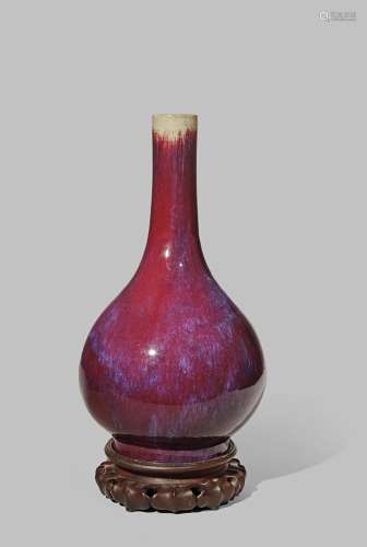 A CHINESE FLAMBE GLAZED BOTTLE VASE 18TH CENTURY With a tall neck and a slightly flared foot,