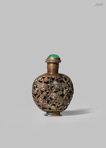 A CHINESE BRONZE 'NINE BUDDHIST LIONS' SNUFF BOTTLE QING DYNASTY The ovoid body reticulated and