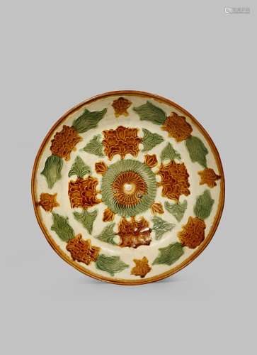A CHINESE SANCAI MOULDED DISH LIAO DYNASTY 907-1125 AD Of circular form moulded with peony