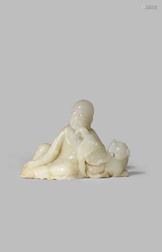 A CHINESE PALE CELADON JADE CARVING OF A LUOHAN QING DYNASTY Sitting in a contemplative pose,