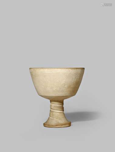 A RARE CHINESE WHITE POTTERY STEM CUP PROBABLY TANG DYNASTY With a plain, gently tapered body