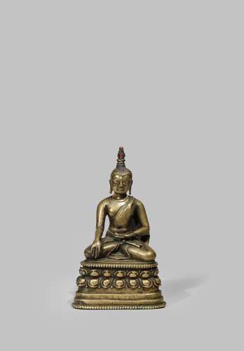 A RARE TIBETAN BRONZE PALA-STYLE FIGURE OF BUDDHA 12TH/13TH CENTURY Seated, meditating on a double