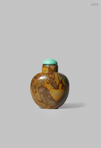 A CHINESE PUDDINGSTONE SNUFF BOTTLE 18TH/19TH CENTURY With a plain ovoid body and irregular