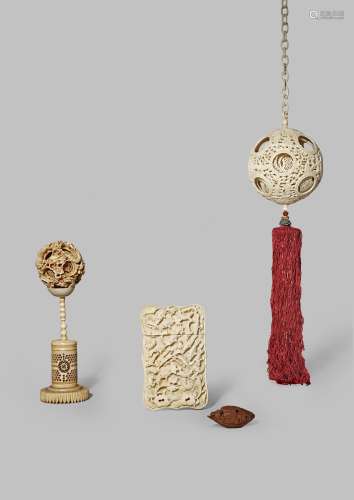 TWO CHINESE CANTON IVORY PUZZLE BALLS AND AN OLIVE STONE CARVING 19TH CENTURY The balls with smaller