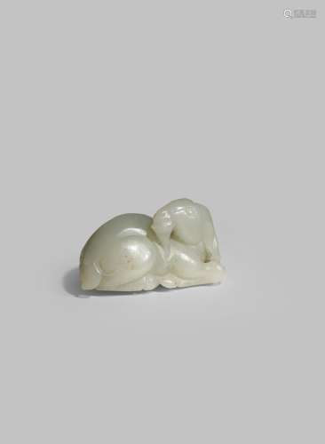 A CHINESE PALE CELADON JADE MODEL OF A GOAT LATE QING DYNASTY Recumbent with his head turned to