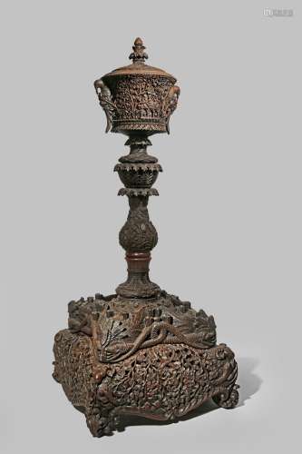 A MASSIVE INDIAN CARVED HARDWOOD ORNAMENTAL VASE AND COVER 19TH CENTURY Constructed in sections