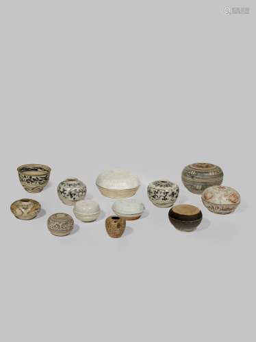 TWELVE SOUTH EAST ASIAN CERAMIC JARS AND BOXES 15TH CENTURY AND LATER Comprising: seven circular