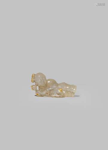 A CHINESE AGATE CARVING OF A BOY QING DYNASTY OR LATER Lying on his side, holding a long spray of