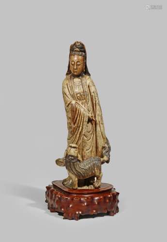 A LARGE CHINESE SOAPSTONE FIGURE OF GUANYIN 18TH/19TH CENTURY Standing, holding a fly whisk in her