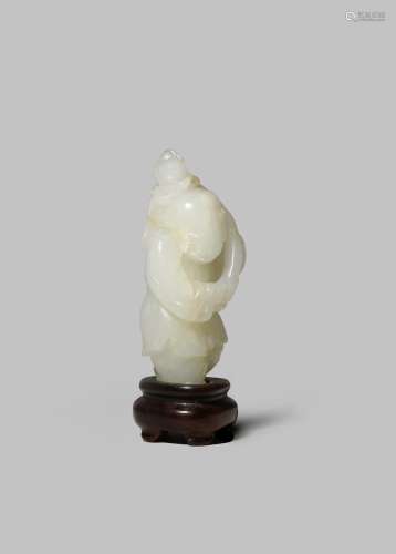 A CHINESE PALE CELADON JADE CARVING OF A BOY QING DYNASTY Carved with his head turned to one side,
