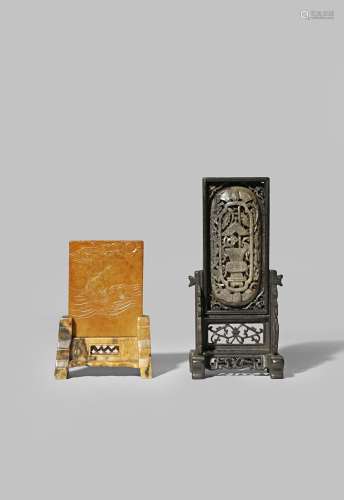 TWO CHINESE MINIATURE TABLE SCREENS QING DYNASTY One of grey jade with a reticulated wood stand, the