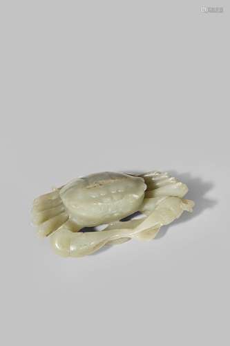 A CHINESE CELADON JADE MODEL OF A CRAB 18TH/19TH CENTURY Seated neatly on top of a millet ear with