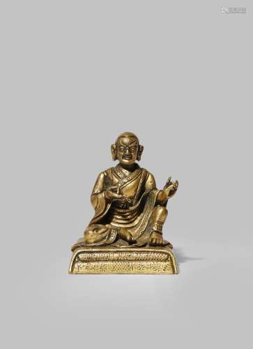 A SMALL CHINESE-TIBETAN GILT BRONZE FIGURE OF A LUOHAN 18TH CENTURY Sitting with both hands