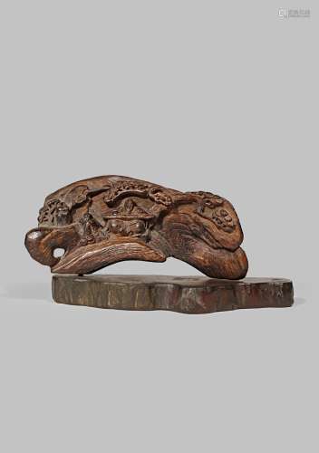 A CHINESE ALOESWOOD CARVING QING DYNASTY OR LATER Carved with a scholar playing a qin and his
