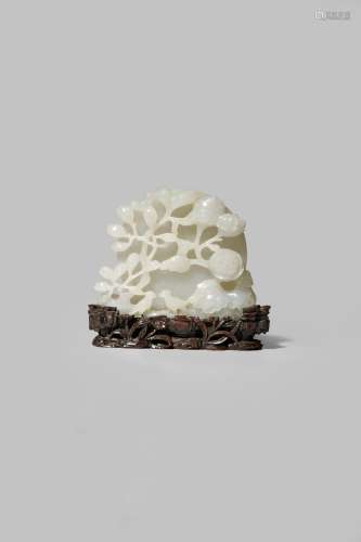 A CHINESE WHITE JADE CARVING OF MAGPIES AND MAGNOLIA QING DYNASTY OR LATER Carved in the form of a