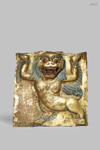 A LARGE TIBETAN GILT COPPER REPOUSSE PLAQUE 19TH CENTURY Decorated with a snow lion standing on