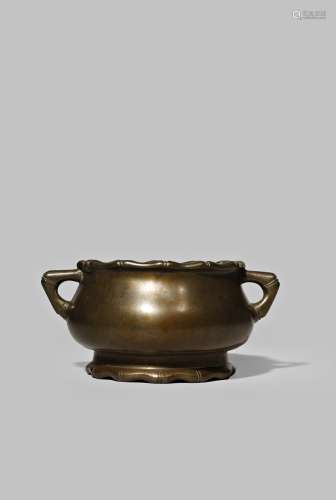 A CHINESE BRONZE INCENSE BURNER QING DYNASTY With a compressed circular body raised on a flared