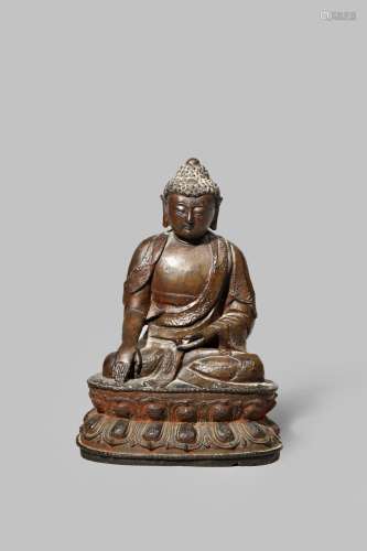 A CHINESE BRONZE MODEL OF BUDDHA MING DYNASTY Seated in vajraparyankasana on a double lotus base,