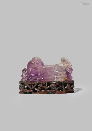 A CHINESE AMETHYST CARVING OF A HORSE AND A MONKEY 19TH CENTURY The horse recumbent, with a bridle