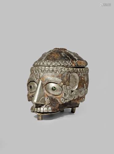 A TIBETAN SKULL CUP, KAPALA 19TH CENTURY With facial features accentuated with silver-gilt elements,