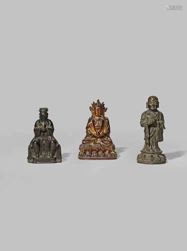 THREE SMALL CHINESE BRONZE FIGURES 17TH/18TH CENTURY One of Avalokiteshvara coated with lacquer