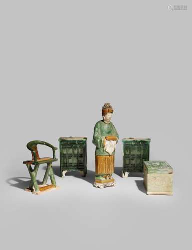 A CHINESE POTTERY FIGURE AND FOUR POTTERY ITEMS OF FURNITURE MING DYNASTY The figure holding a