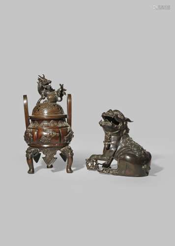 A CHINESE BRONZE LION DOG INCENSE BURNER 17TH CENTURY With his left paw on a brocade ball