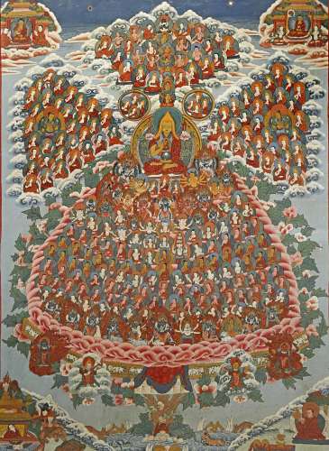 A TIBETAN THANGKA 20TH CENTURY Decorated with many figures around a central lama in an enormous