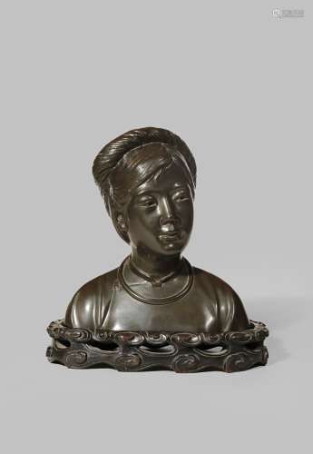 A CHINESE BRONZE BUST OF A YOUNG GIRL 20TH CENTURY Wearing a traditional qipao and a simple