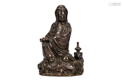 A LARGE CHINESE SILVER INLAID BRONZE GUANYIN. Signed Shisou. Seated in lalitasana beside a vase