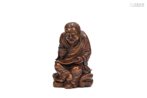 A CHINESE BAMBOO CARVING OF AN OLD MAN. 19th / 20th Century. Carved to depict a seated bearded man