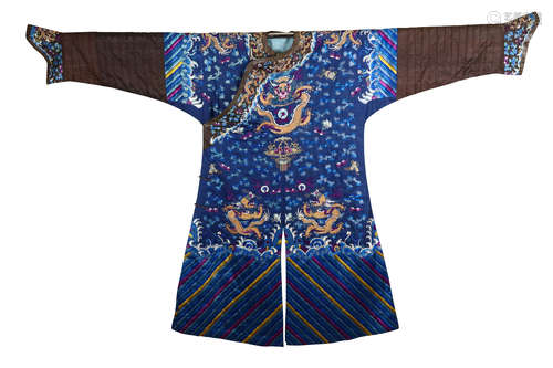 A CHINESE BLUE GROUND ‘DRAGON’ ROBE. Qing Dynasty. Embroidered with five clawed dragons among