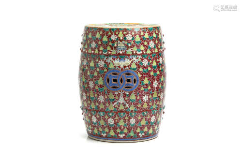 A CHINESE FAMILLE ROSE BARREL-FORM DRUM STOOL. Late Qing Dynasty. Decorated to the body with
