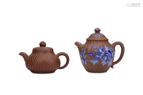 TWO CHINESE YIXING TEAPOTS AND COVERS. Qing Dynasty, 19th Century. One with a spiral ribbed design