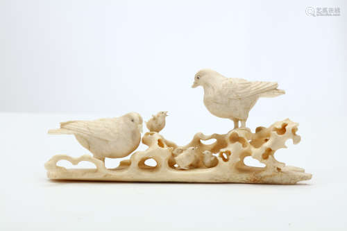 AN IVORY AND BONE OKIMONO OF DOVES. Meiji period. Well carved with a pair of doves standing around