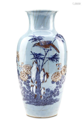 A CHINESE LIGHT BLUE GLAZED VASE WITH UNDERGLAZE BLUE, COPPER RED AND WHITE SLIP DECORATION. Qing